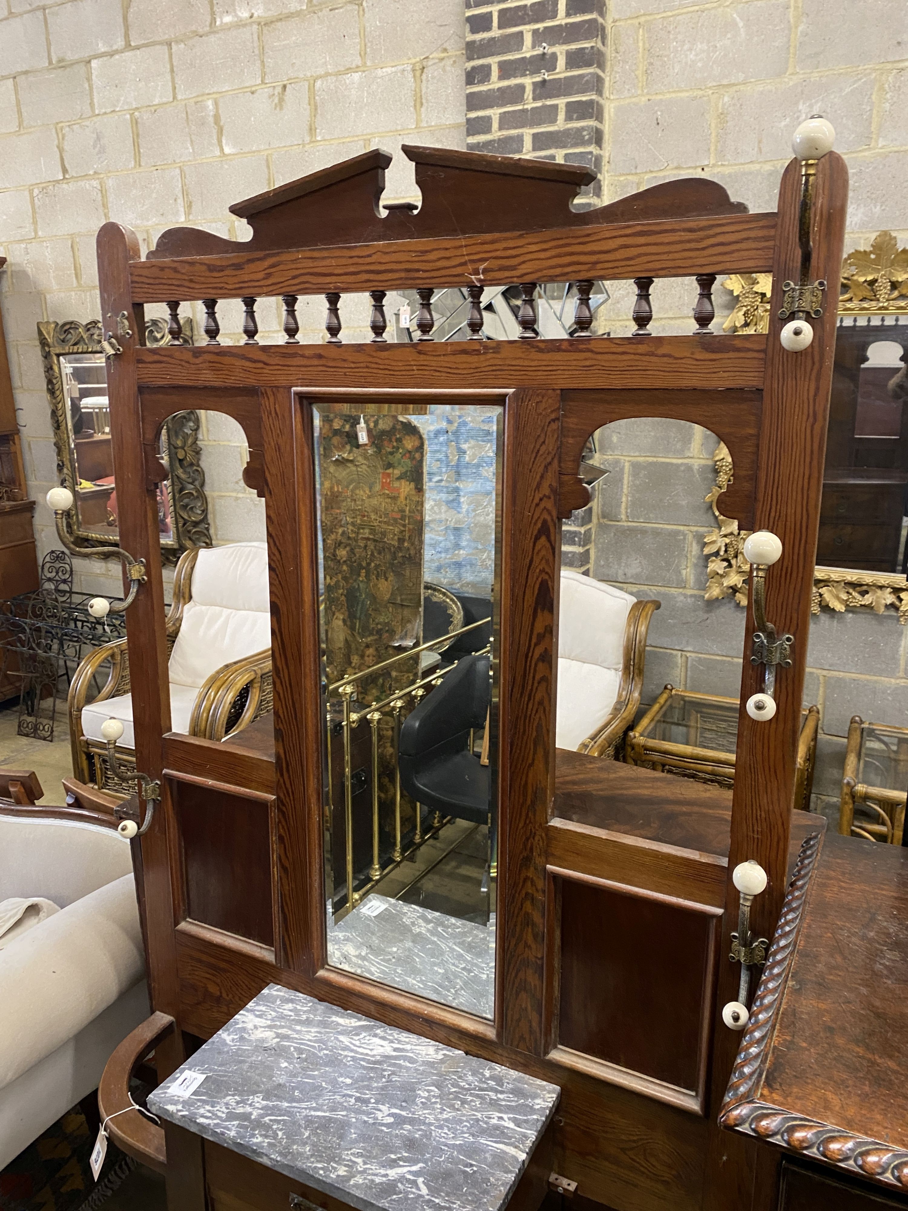 A Victorian marble topped pitch pine hall stand, width 96cm, height 196cm